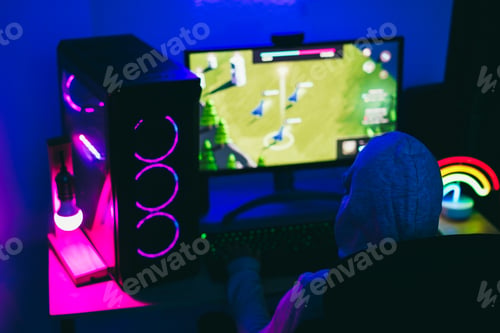 Preview: Gamer Playing At Strategy Game While Streaming Online - Focus On Head