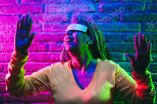 Preview: Asian Senior Woman Using Augmented Reality Futuristic Glasses - New Metaverse Technology Trend