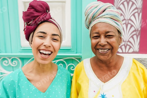 Preview: Happy African Mother And Her Daughter Wearing Afro Clothes - Ethnic, Culture And Family Concept