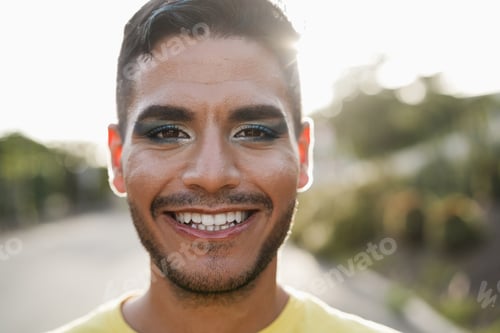 Preview: Young Transgender Man With Makeup Smiling On Camera - Focus On Face