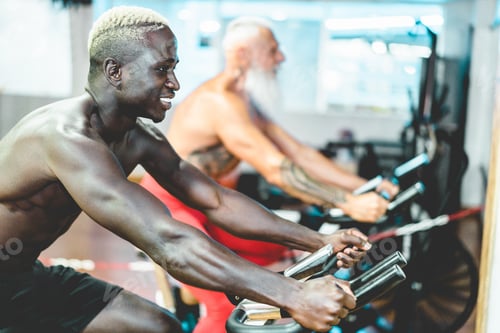 Preview: People From Different Generation And Ethnicities Doing Workout Session On Cardio Cyclette Inside