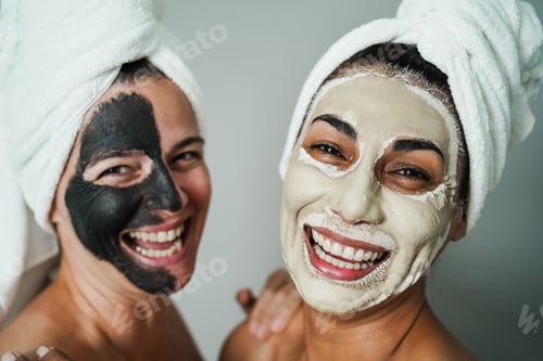 Preview: Senior Women Doing Beauty Treatment Using Beauty Skin Masks - Focus On Right Female Face