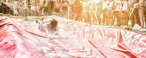 Preview: Young People Having Fun With Soap Water Slide On The Beach Party Outdoor - Crowd Enjoy Music