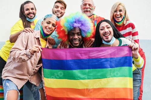 Preview: Gay People At Pride Parade With Lgbt Flag While Wearing Protective Face Mask - Main Focus On Left