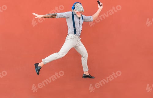 Preview: Crazy Senior Man Jumping And Dancing Rock Music Wearing T-Rex Mask - Tattoo Trendy Guy Having Fun