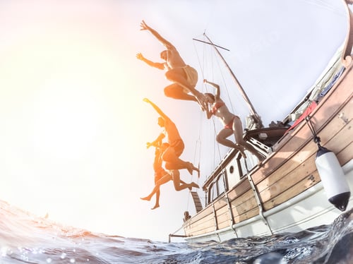 Preview: Multiracial Young People Diving From Sailing Boat Into The Sea - Cheerful Friends Having Fun In