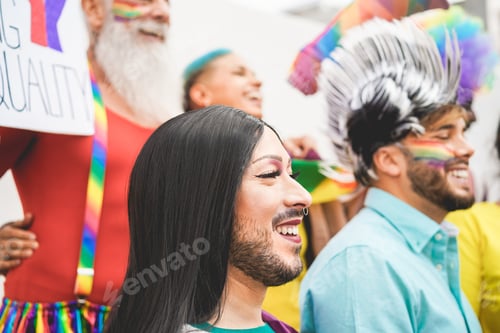 Preview: Group Of People With Rainbow Flags And Banners During Gay Pride Event - Lgbt Concept - Focus On