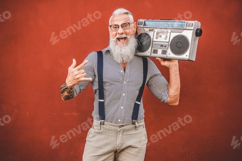Preview: Senior Crazy Man With Boombox Stereo Playing Rock Music - Trendy Mature Guy Having Fun Dancing With