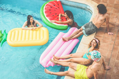Preview: Happy Friends Floating With Air Lilo Ball At Swimming Pool Party - Young People Having Fun On