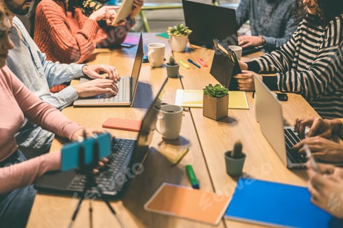 Preview: Young Business People Working Inside Modern Coworking Office - Focus On Left Man Hands