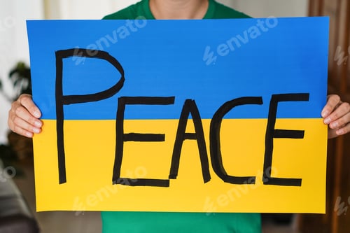 Preview: Woman Holding Ukrainian Flag - Peace And No War Concept - Focus On Banner