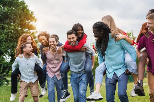 Preview: Young Diverse Friends Having Fun Outdoor Laughing Together - Focus On Center African Girl Face