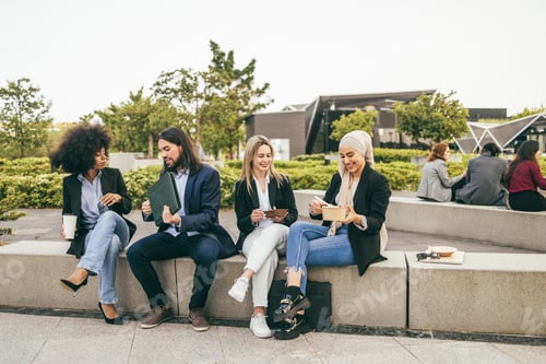 Preview: Multiethnic Business People Doing Lunch Break Outdoor From Office Building - Focus On Arabian Girl