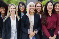 Preview: Professional Women Smiling and Standing Together Outside Office