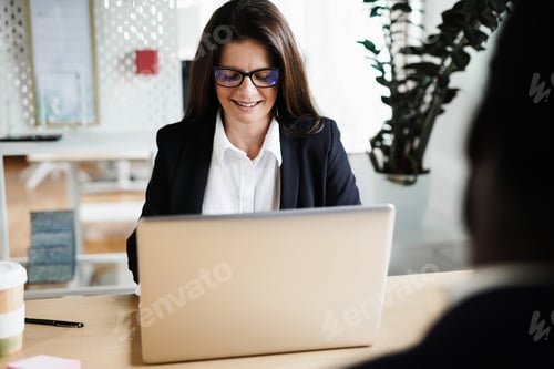 Preview: Business Woman Using Laptop While Inside Modern Coworking Office - Focus On Face