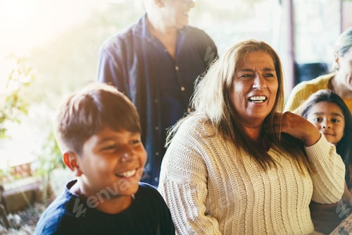 Preview: Happy Latin Family Having Fun Together At Home - Soft Focus On Grandmother Face