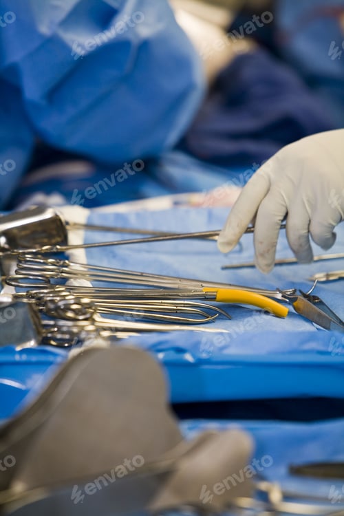 Preview: Surgical tools on sterile blue surface in hospital