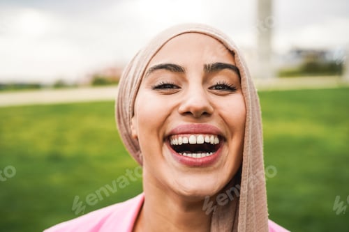 Preview: Young Arabian Girl Smiling On Camera Outdoor - Focus On Face