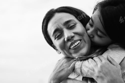 Preview: Happy Latin Mother And Daughter Having Fun Together Outdoor - Focus On Mother Face - Black And