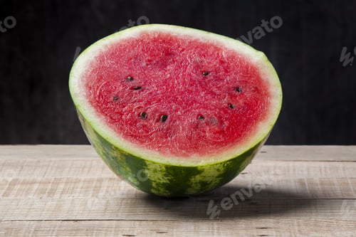 Preview: A Sliced Of Jucie Watermelon On A Wooden Background