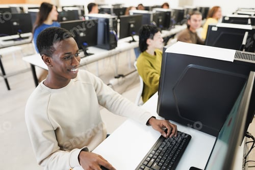 Preview: Young African Student Using Computer Inside College Room At School University - Focus On Left Eye