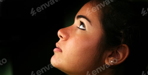 Preview: Young Beautiful Hispanic Lady Looking Up