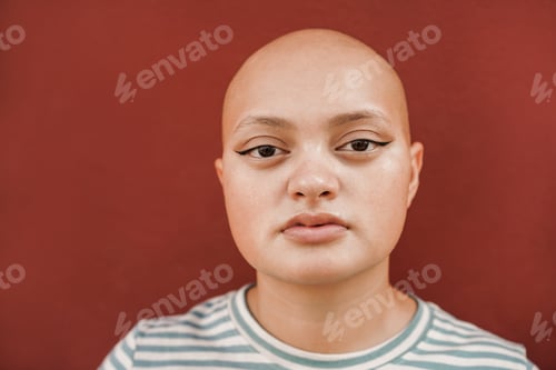 Preview: Bald Girl Posing In Front Of Camera With Red Background - Real People, Diversity And Female Power