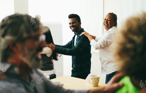 Preview: Multiracial Happy Friends Having Fun Dancing Together In The Kitchen - Soft Focus On Indian Man Face