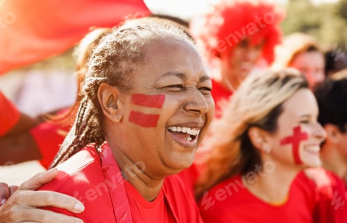 Preview: African Senior Red Sport Fan Supporting Their Team - Multiracial Football Supporters Having Fun At