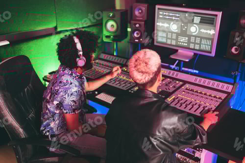 Preview: Musician And Sound Engineer Mixing New Album Inside Boutique Recording Studio - Technology And