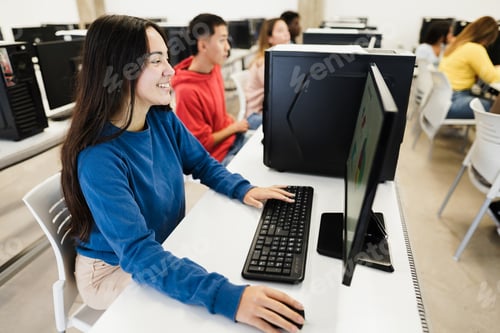 Preview: Young Students Using Computers During Business Class At School - Focus On Girl Face