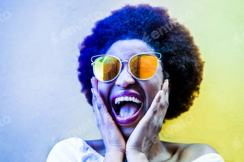 Preview: Excited Woman in Sunglasses Laughing in Urban Setting