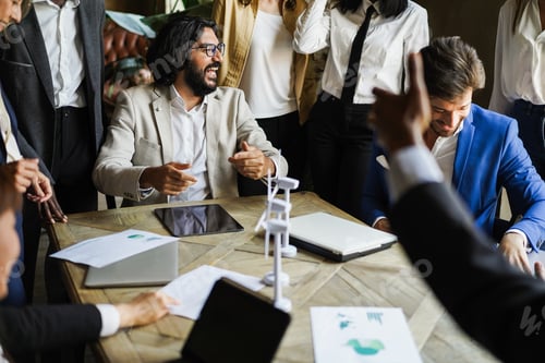 Preview: Happy Multiracial Business People Working On Sustainable Innovation Project - Focus On Arabian Man