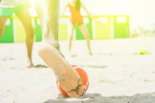 Preview: Young Multiethnic Friends Playing Soccer On The Beach - Group Of People Playing Football Match On