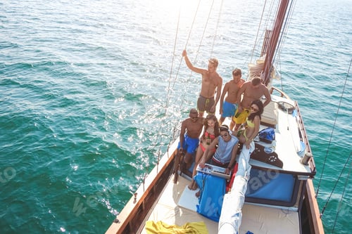Preview: Group Of Young People Dancing In Sailing Boat Party With Dj Playing Music - Top View Of Multiracial