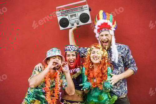 Preview: Happy Dressed People Celebrating At Carnival Party Throwing Confetti - Main Focus On Right Girl Face