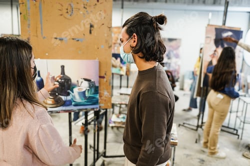 Preview: Young Students Painting Inside Art Room Class At College - Main Focus On Right Guy Head