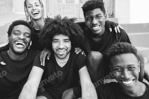 Preview: African Friends Doing Selfie With Mobile Phone Outdoor - Focus On Center Man Face - Black And White