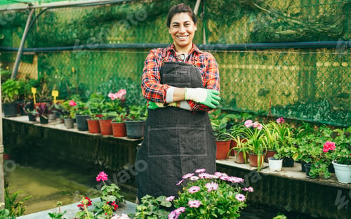 Preview: Portrait Of Latin Woman Working Inside Greenhouse Garden - Focus On Face