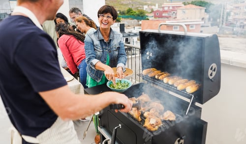 Preview: Happy Friends Cooking Corncobs And Chicken At Barbecue Rooftop Dinner - Multigenerational People