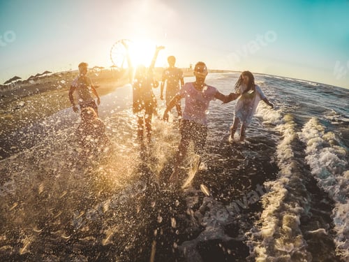 Preview: Happy Friends Having Fun On The Beach At Sunset - Young People Playing Inside Sea Water Outdoor In