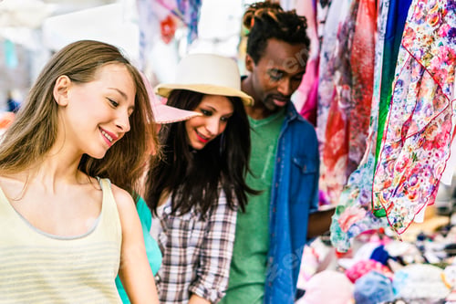 Preview: Multi-Ethnic Best Friends Choosing Clothes At The Weekly Cloth Market - Young People Sharing Free