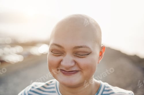 Preview: Bald Girl Smiling In Front Of Camera With City On Background - Focus On Eyes