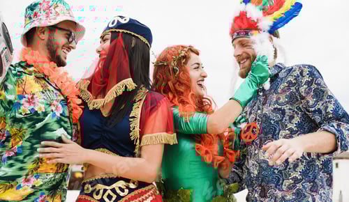Preview: Happy Dressed People Celebrating At Carnival Party Dancing Together - Focus On Right Girl Face
