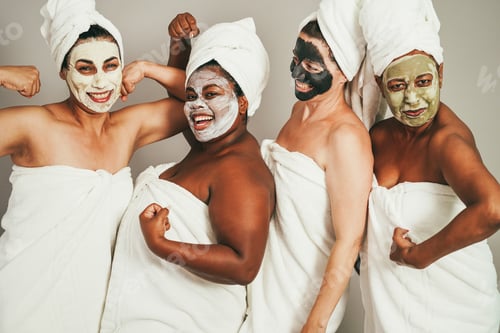 Preview: Multigenerational Women Having Fun Wearing Skin Care Beauty Masks - Main Focus On African Girl Face