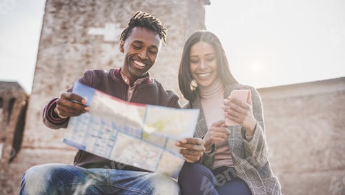 Preview: African Couple Looking City Map During Vacation Tour - Happy Young People Having Fun In Down Town