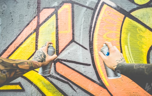 Preview: Graffiti Artist Painting With Color Spray On The Wall - Tattoed Writer At Work In Suburb