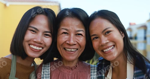 Preview: Asian Mother With Daughters Smiling In Front Of Camera At Home Terrace - Happy Family Having Fun