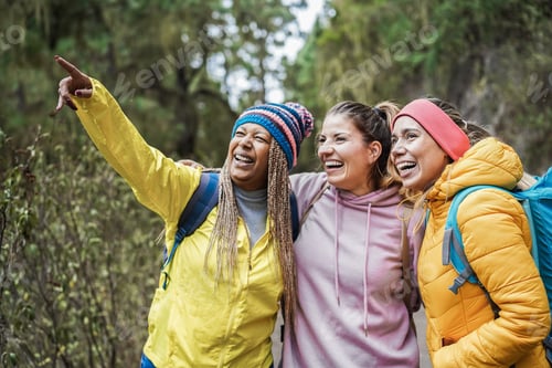 Preview: Multiracial Women Having Fun During Trekking Day In To The Wood - Focus On Right Woman Face