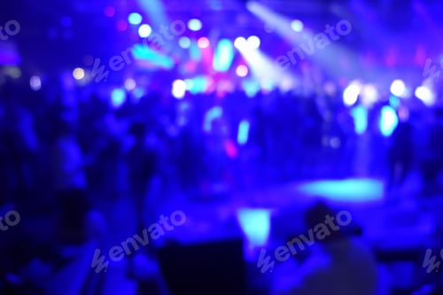 Preview: Blurred People Dancing With Original Laser Blue Lights In Background - Defocused Image Of New
